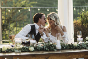 An intimate wedding celebration surrounded by rolling hills and vineyards.